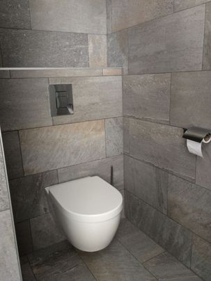 Toilet met grijze tegels